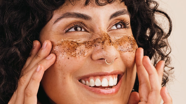 woman with exfoliating mask on face