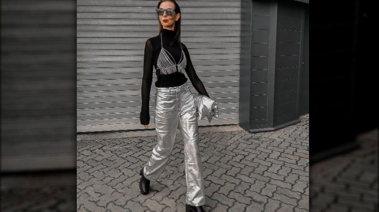 Woman wearing metallic silver pants 