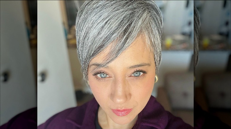 Woman with gray momager haircut