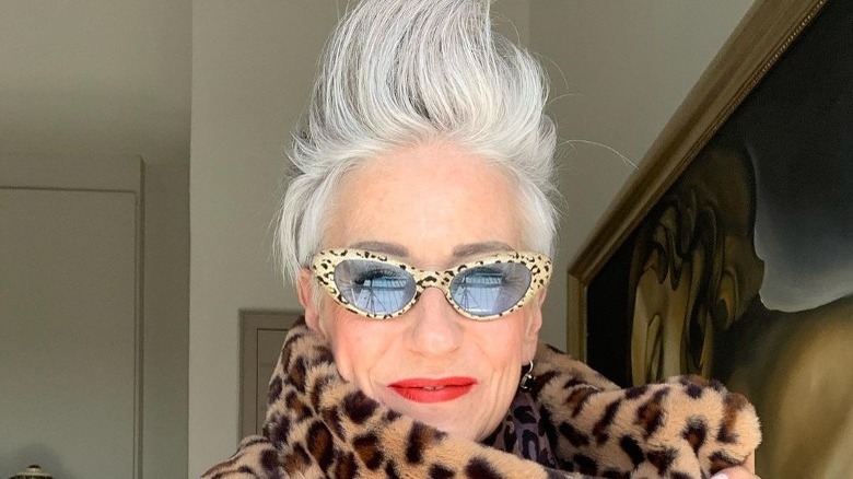 Woman with gray pixie mohawk