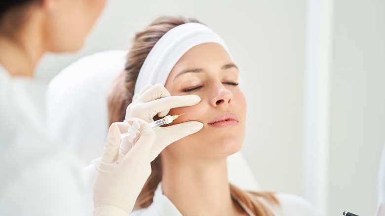 Woman undergoing cosmetic procedure