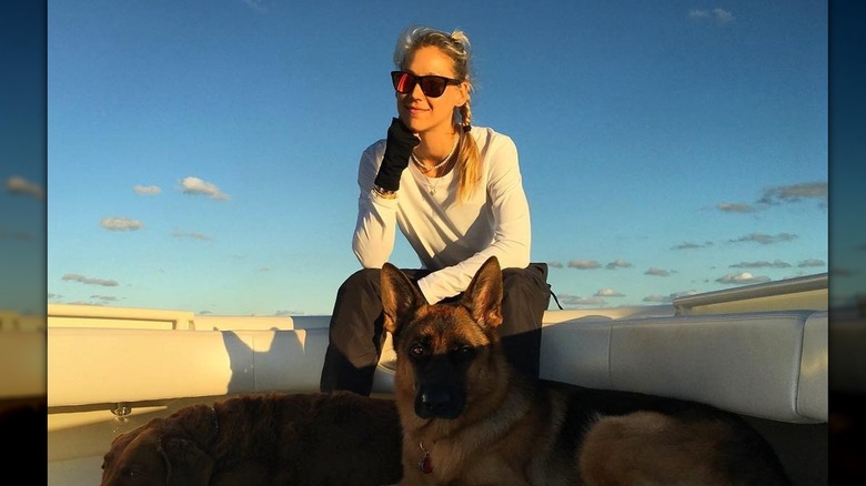 Anna Kournikova sitting on boat