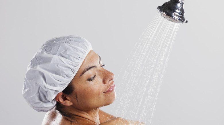 woman wearing shower cap