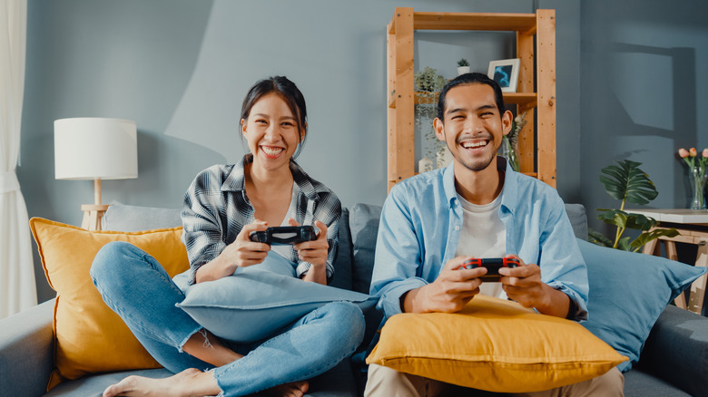 Two friends playing video games 