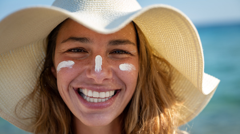 Woman with hat and sunscreen