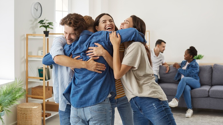 group of friends hugging