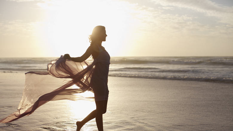 Woman at sunset on beach 