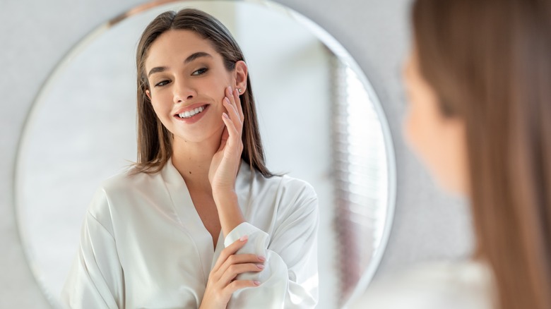 A woman looking in the mirror