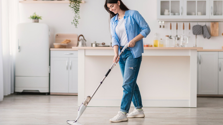A woman cleaning her floors