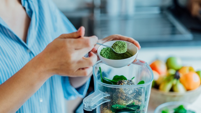 Woman making a smoothie