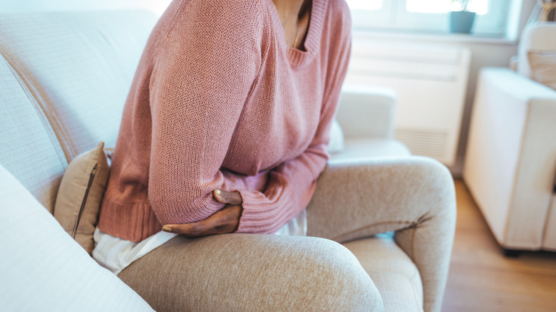 Woman holding her stomach