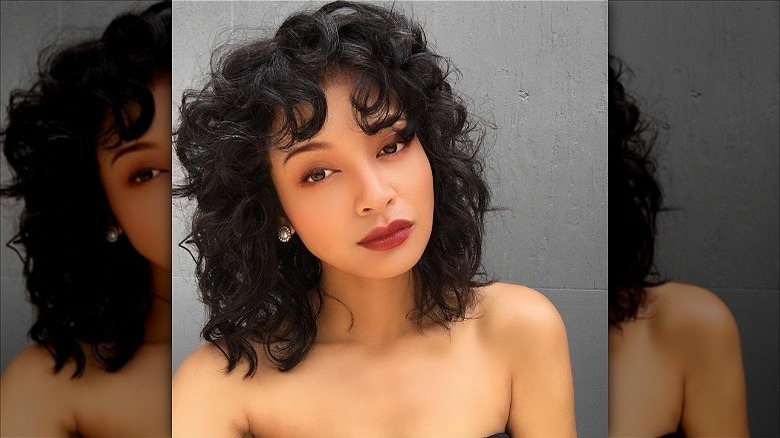 woman with thick curly shag cut