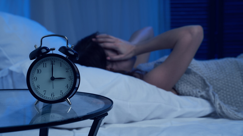 woman lying awake in bed