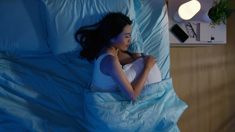 woman sleeping in bed at night