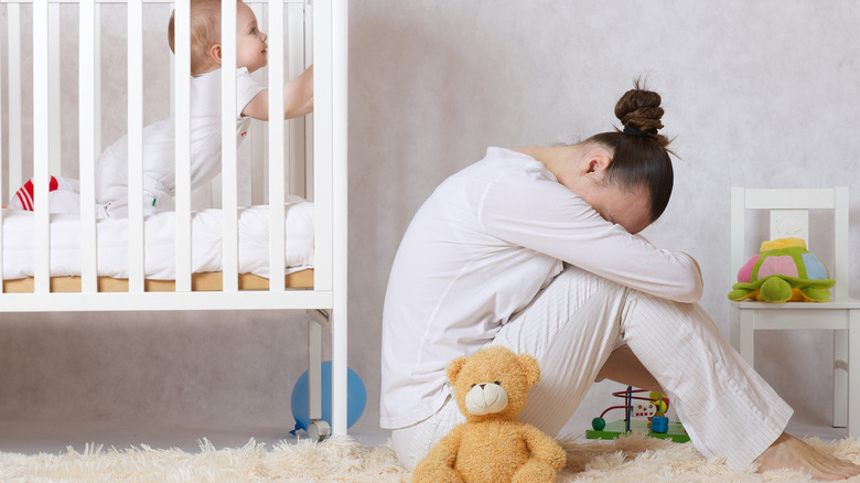 Woman crying in nursery