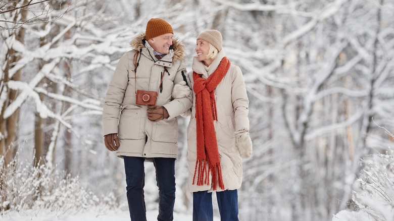 Couple smiling in snowy weather