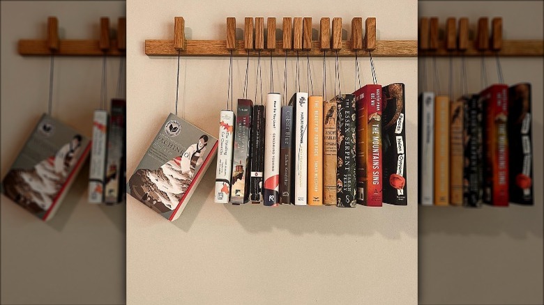 books hanging from clips