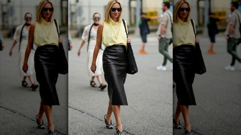 Woman wearing a black pencil skirt 