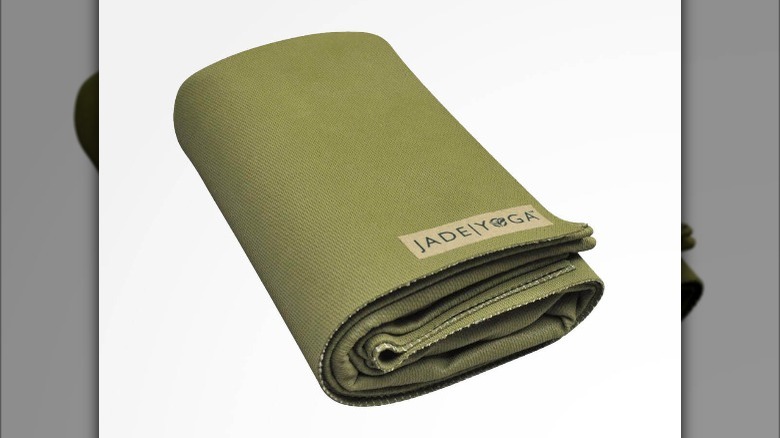 green folded yoga mat