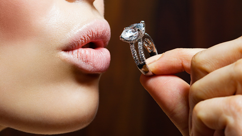 Woman holding diamond ring