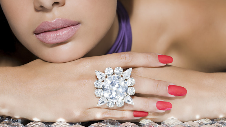 Woman wearing large diamond ring