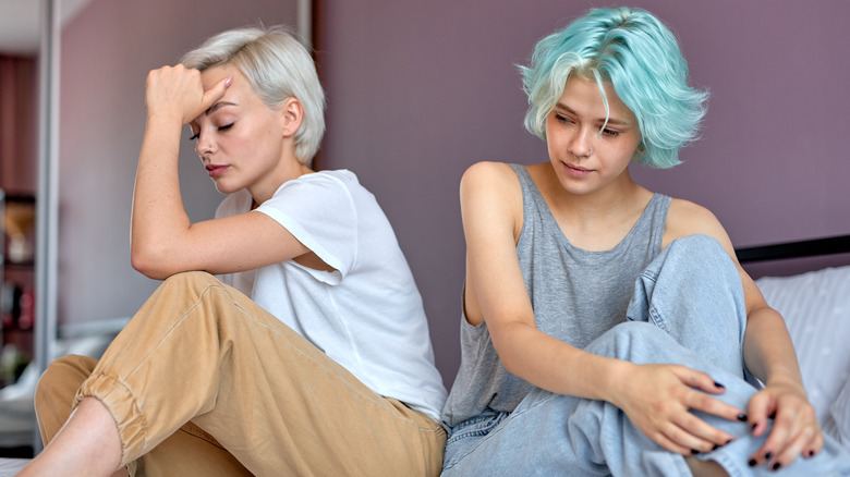 unhappy couple in bed