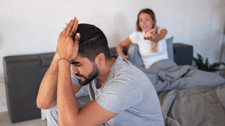 unhappy couple in bed