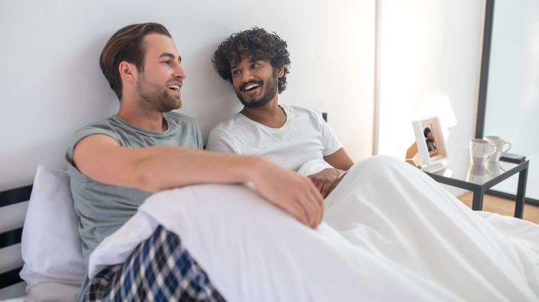 happy couple in bed