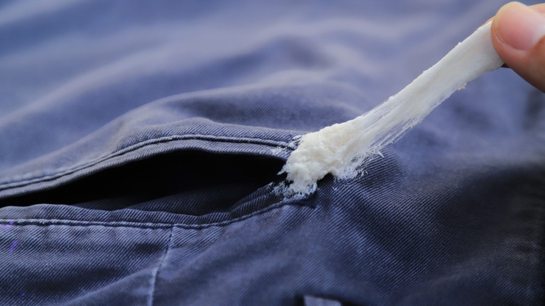 gum stuck to black pants