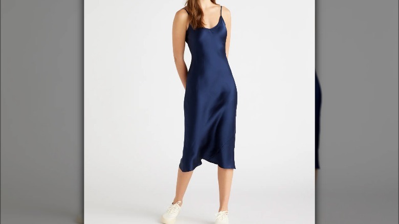 Woman wearing navy slip dress