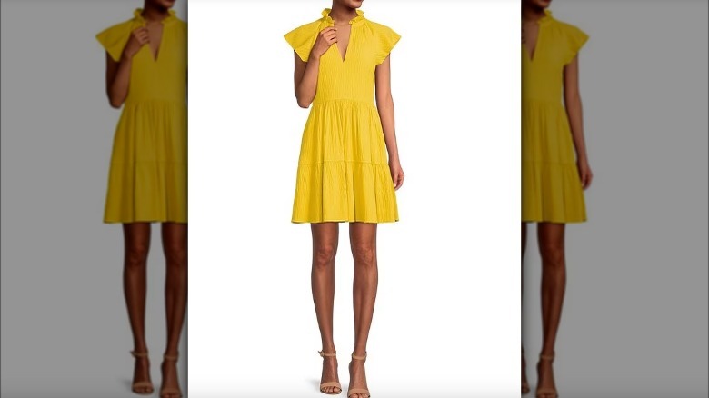 Woman wearing yellow sundress