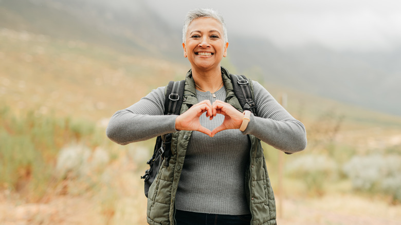 woman with hands as heart