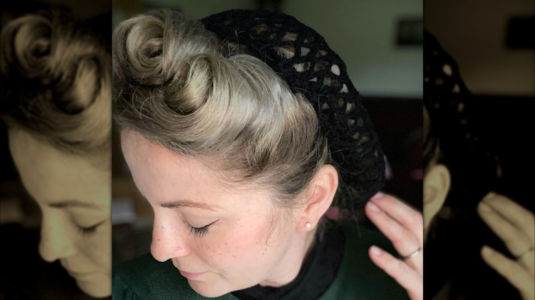 woman with victory rolls