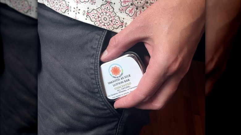 lotion bar in person's pocket