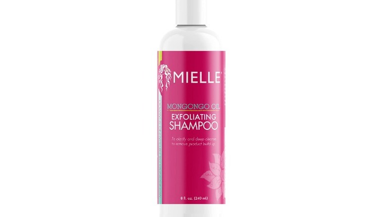pink bottle of shampoo