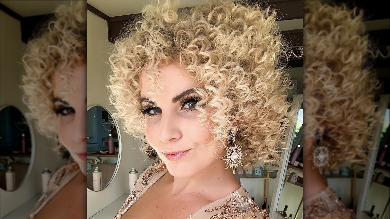 A woman with disco curls