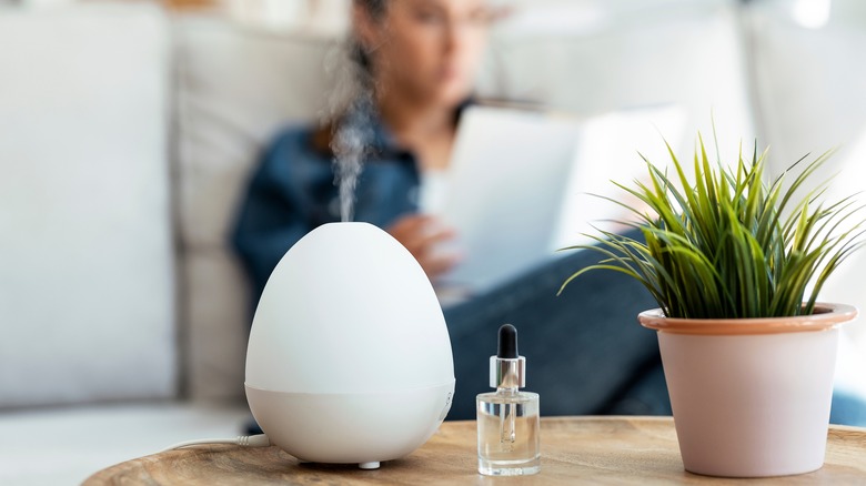 Person diffusing essential oils