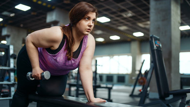 Overweight woman at gym 