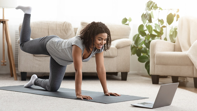 Woman doing pilates at home