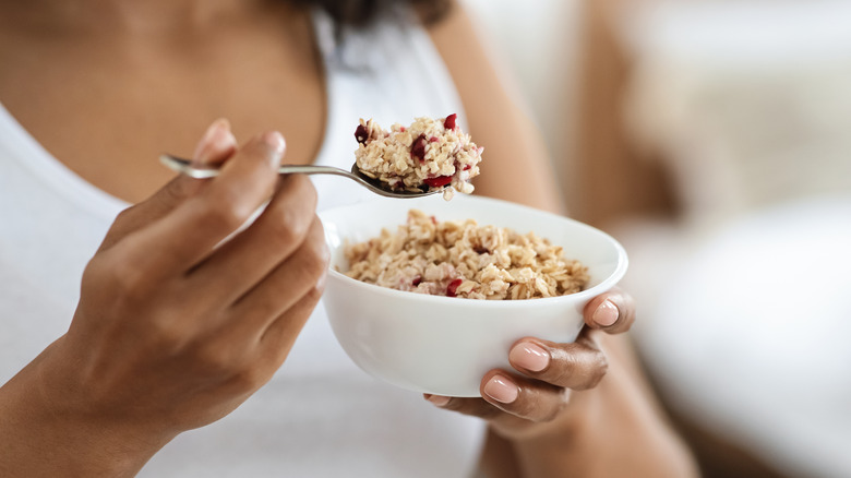 Close up of woman eating oatmeal