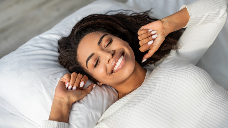 A woman sleeping on her back