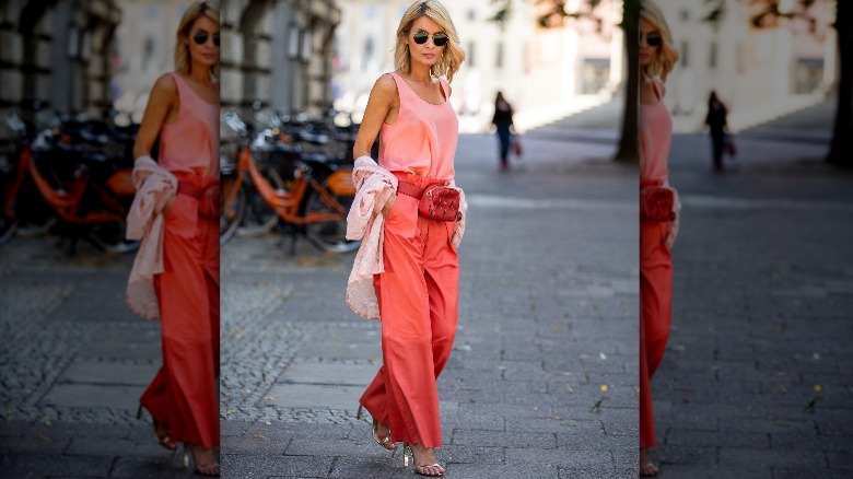 Person in pink and coral outfit