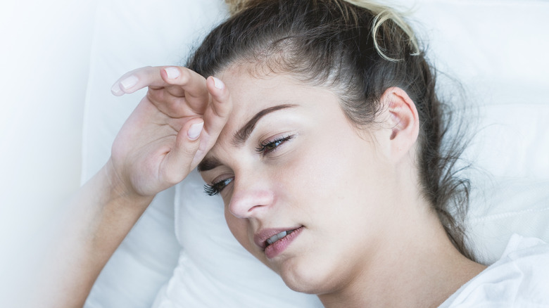 woman in bed faint 