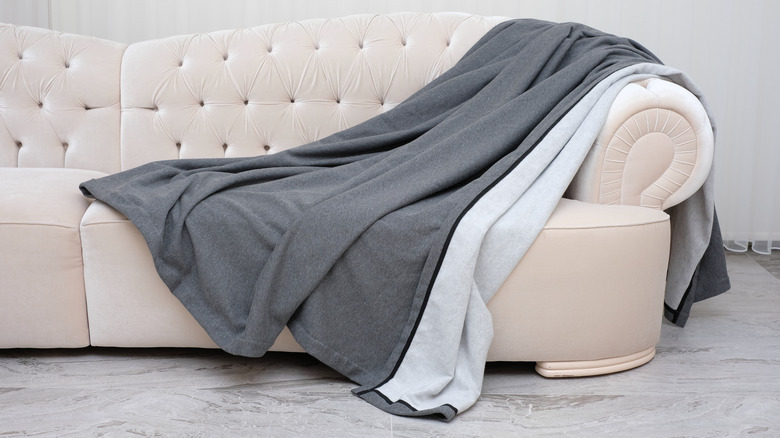 gray blanket throw on a couch