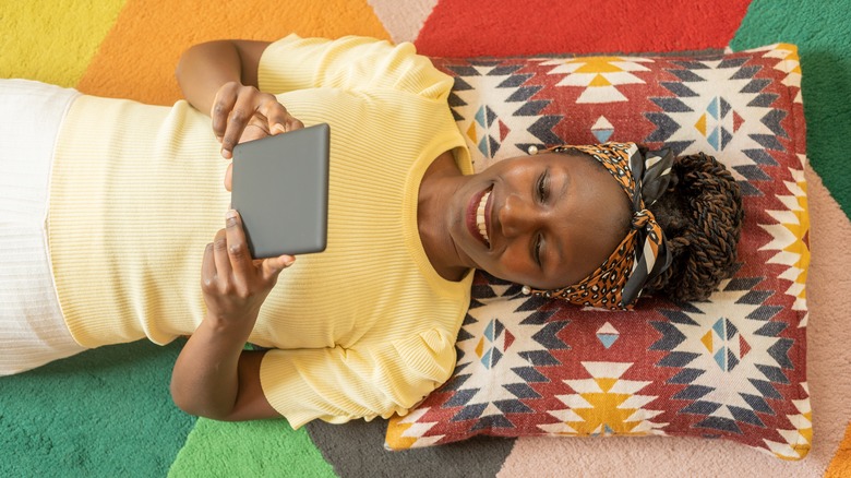 woman reading kindle