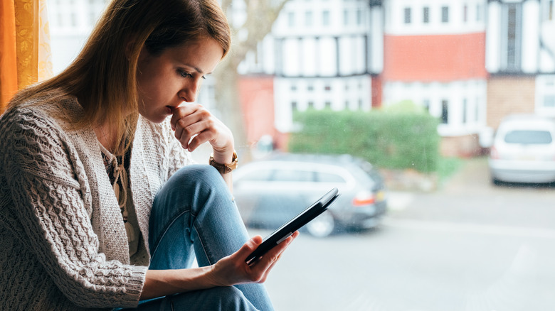 woman reading kindle