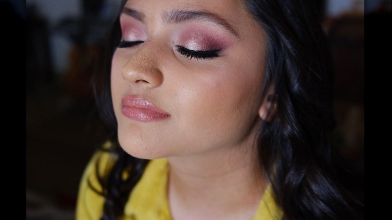 Woman with pink champagne makeup