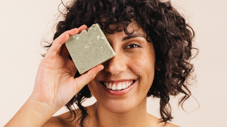 Woman with bar of soap