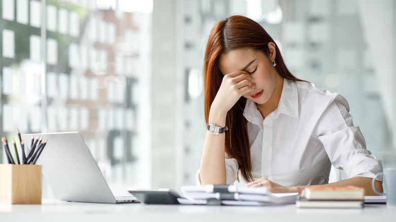 Stressed woman at desk