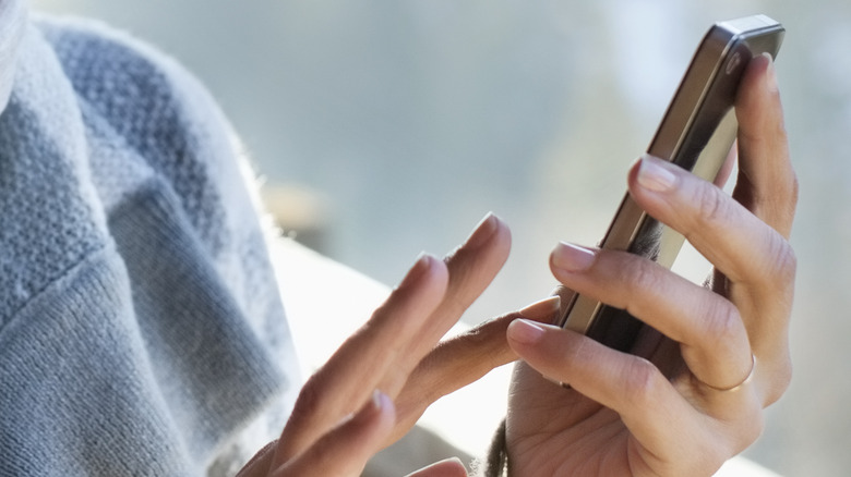 woman using her phone 